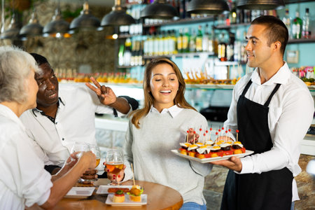 View on the Latino young man offering pinchosの写真素材