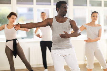 Choreographic class where ballerinas and ballet troupe rehearse dances