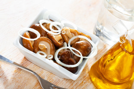 Shiitake mushrooms marinated with onions closeup