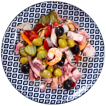 There is portion of seafood tapas salpicon with green and black olives on plateの写真素材