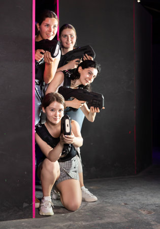 Together girls wait for enemy, effect of surprise, competitions, struggle of laser weaponsの写真素材