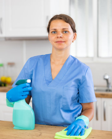 Portrait of positive housewife during cleanupの写真素材