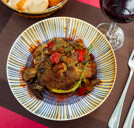 Baked pork cheek served with vegetablesの写真素材