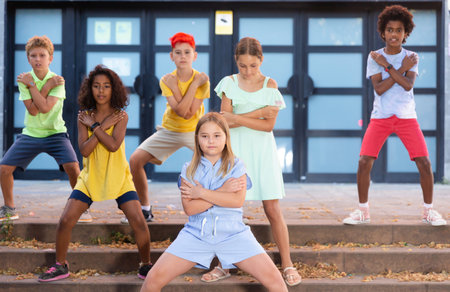 Group of kids performing street dance outdoorsの写真素材