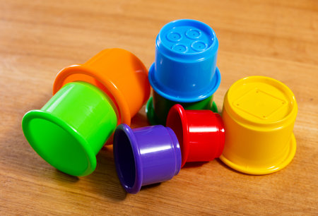 Childrens toy plastic cup pyramid made of multicolored elements