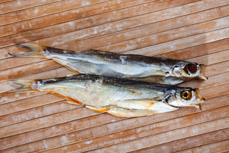 Image of air-dried salted sabrefish on wooden backgroundの写真素材
