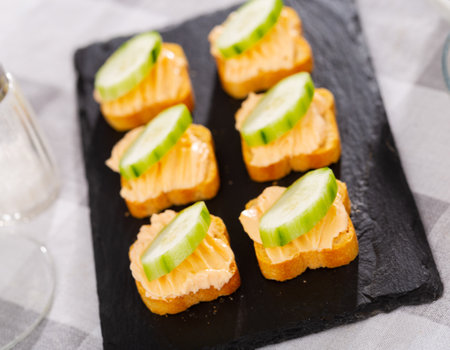 Tasty snack before lunch - sandwiches with cucumber and pateの写真素材