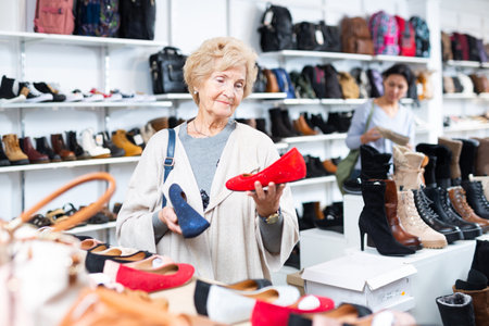 Mature woman chooses ballet flatsの写真素材