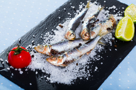 Slate of baked in oven anchoviesの写真素材
