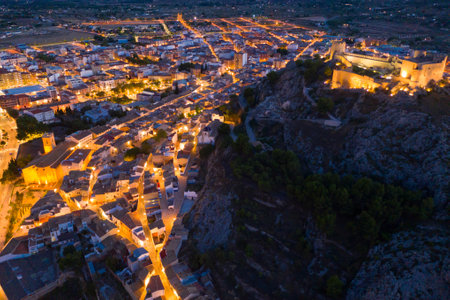 Aerial view of fortified Castalla Castle on stone hill in twilight, Spainの写真素材