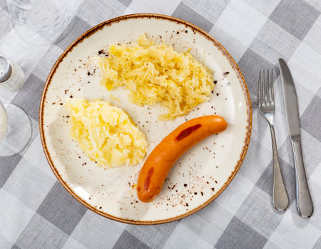 Fried sausages with mashed potatoes and sauerkraut - simple but healthy dishの写真素材