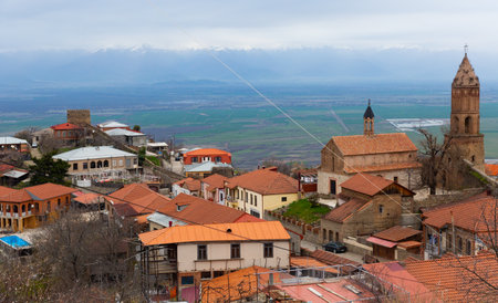Scenic spring view of Sighnaghi on background of Alazani valley and Greater Caucasusの写真素材