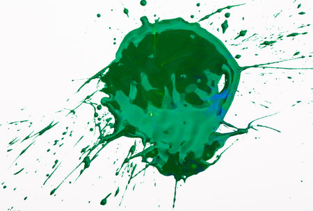 Green paint spot on paper, colorfull artistic image on white backgroundの写真素材