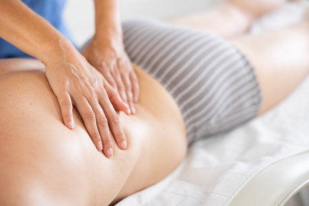 massage therapist doing a back massageの写真素材