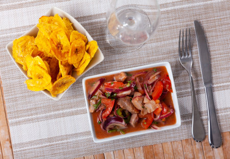 Ceviche served with fried banana in bowlの写真素材