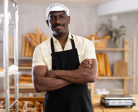 Portrait of positive man baker