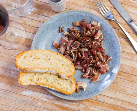 Sliced pig ears served on platterの写真素材