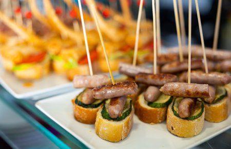 Spanish sausages on skewers and breadの写真素材