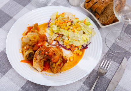 Baked chicken and mixed vegetable saladの写真素材