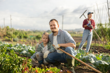 with his son in a cabbage gardenの写真素材