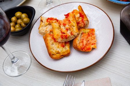 Traditional Spanish toasted bread with tomato with olive oilの写真素材