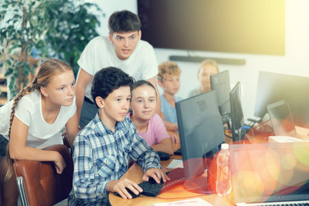 Group of students working at computer in classroomの写真素材