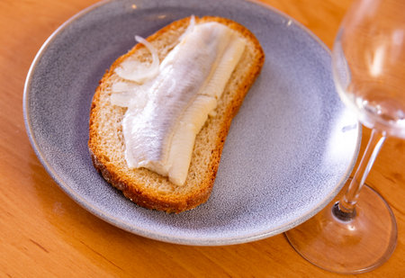 Sandwich with lightly salted herring fillet and pickled onionsの写真素材