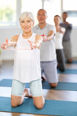 Elderly woman exercises with pilates bandの写真素材