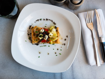 National Spanish coca de escalibada with goat cheese and olivesの写真素材