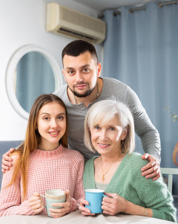 Portrait of happy family at home interior