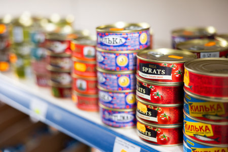 Russian goods store shelves have wide range of canned sprats in oil and tomato sauceのeditorial素材