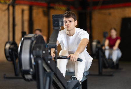 Man exercising on a rowing machine
