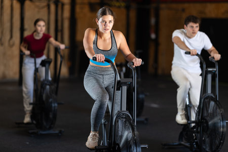 Woman in the top is engaged in an airbikeの写真素材