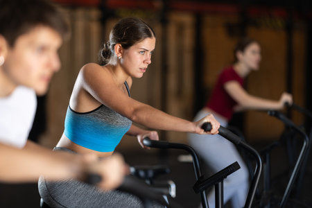 Woman in the top is engaged in an airbikeの写真素材