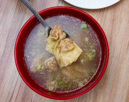Traditional Chinese wonton soup is hearty first course made from fountains filled with minced porkの写真素材