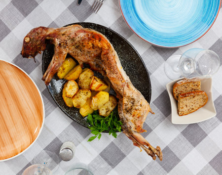 Dish of stewed rabbit with spices and boiled potatoesの写真素材