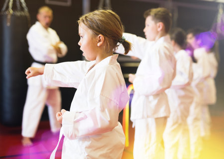 Girl practicing new moves during karate classの写真素材