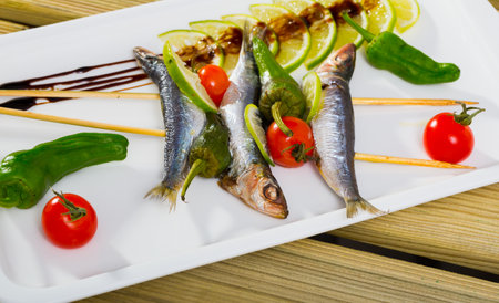 Anchovies roasted on grill with vegetablesの写真素材