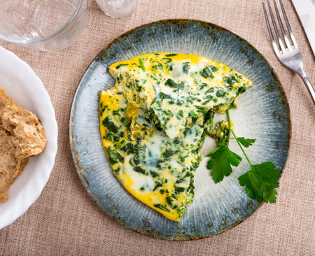 Appetizing breakfast omelette with spinachの写真素材