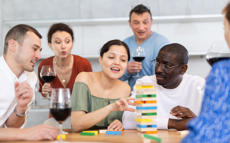 Multiethnic group of emotional people excitedly playing