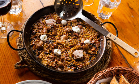 Mountain paella with mushrooms served in a plateの写真素材