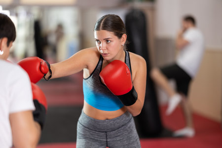 Woman sparring in boxingの写真素材