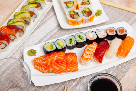 Different types of sushi and sashimi on tableの写真素材