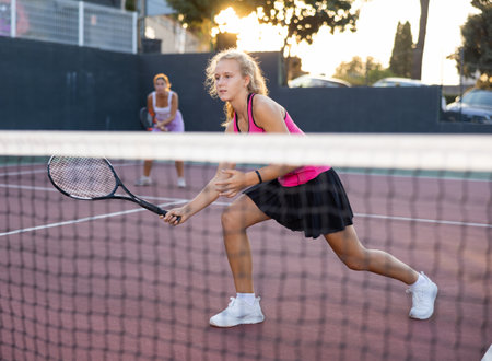 Active tennis girl in court ready for play and trainの写真素材