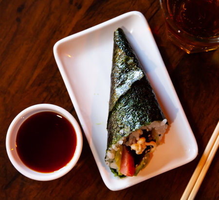 Rolled temaki sushi. Traditional japanese cuisineの写真素材