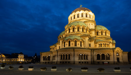 Majestic cathedral with evening illumination against the night skyの写真素材
