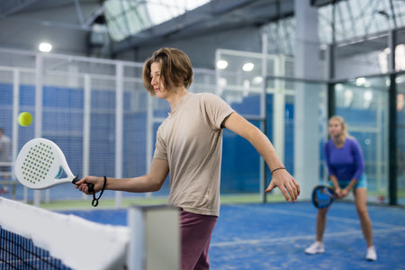 Portrait of a guy tennis player playing padelの写真素材