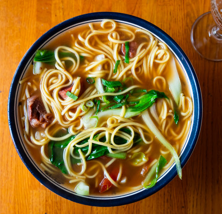 Soup with pasta and boiled beef tenderloin is traditional Chinese cuisine dishの写真素材