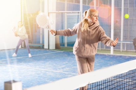 European woman playing padelの写真素材