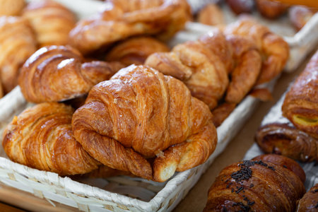 Fresh croissants on a shelf in the store
